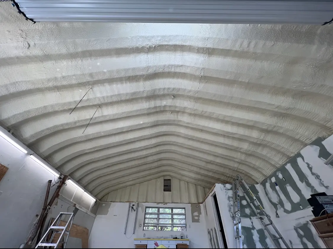 Spray polyurethane foam applied to the underside of a metal roof deck in Torrington